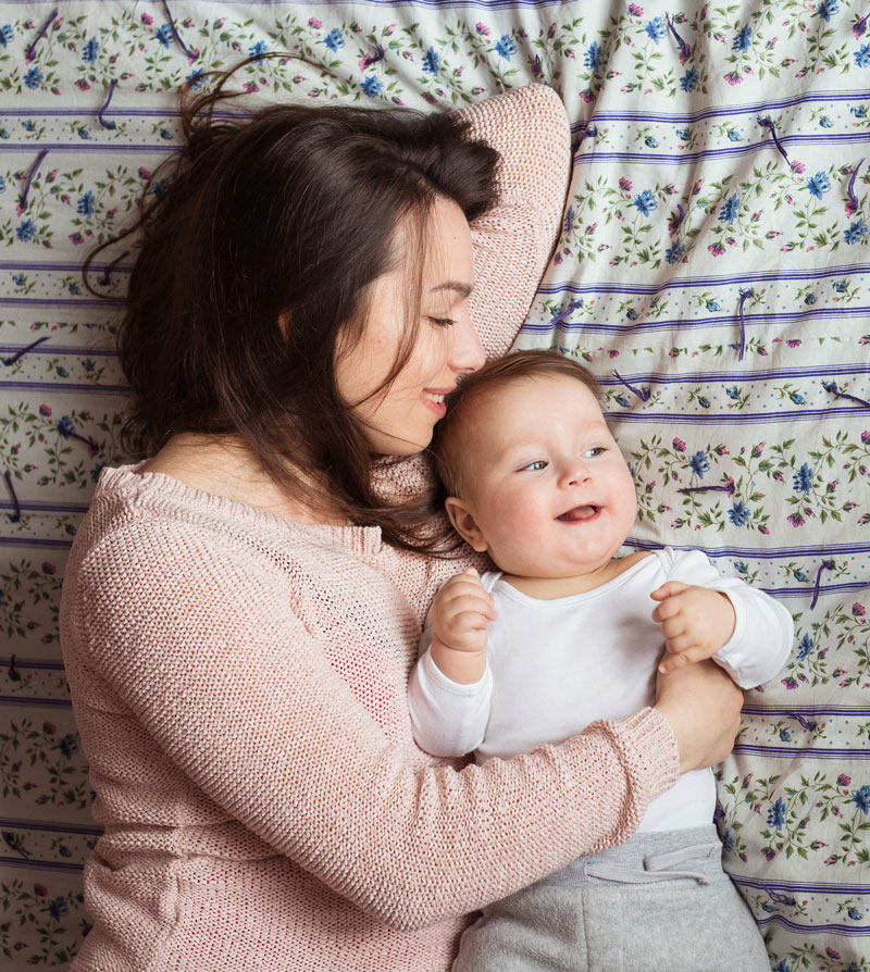 a-mother-and-baby-child-on-a-bed